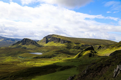 Scenic view of landscape and mountains against sky