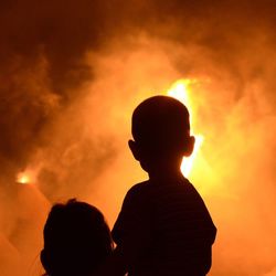 Silhouette of people at sunset