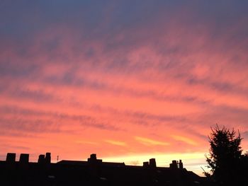 Silhouette of built structure against dramatic sky