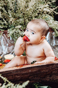 Portrait of cute baby girl looking away