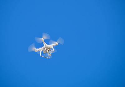 Drone flying in the clear blue sky