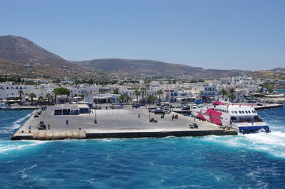 Scenic view of swimming pool by sea against clear sky