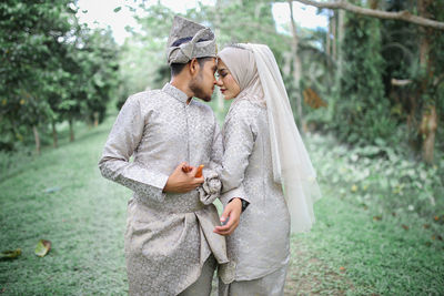 Young couple standing outdoors