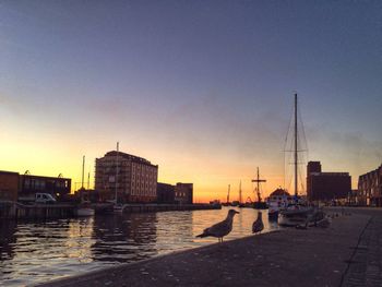 Buildings in city at sunset