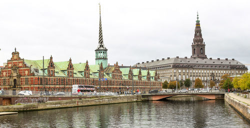 Borsen building and christiansborg palace against sky
