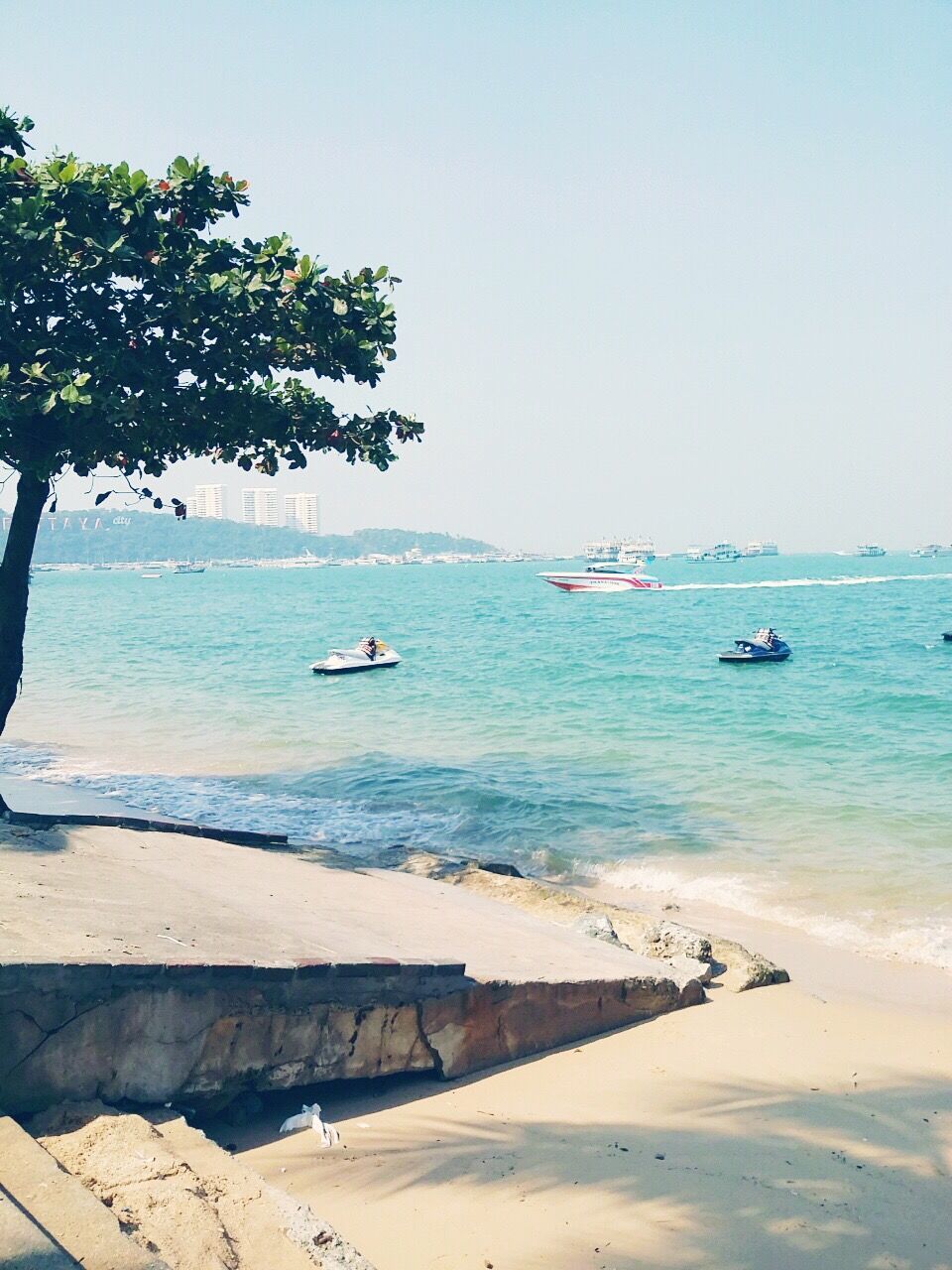 sea, nautical vessel, water, transportation, boat, mode of transport, beach, horizon over water, tranquil scene, tranquility, shore, clear sky, scenics, beauty in nature, moored, nature, blue, sand, tree, sky