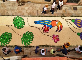 High angle view of people on multi colored wall
