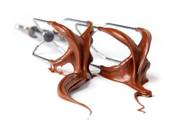 High angle view of chocolate on table against white background