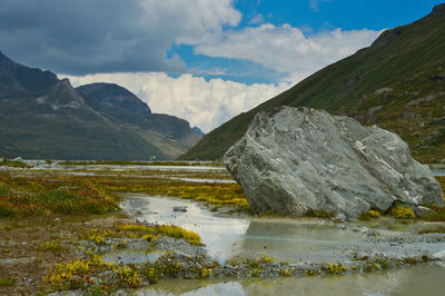 Scenic view of lake and mountains against sky