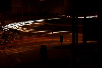 High angle view of light trails on road at night