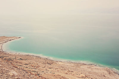 Aerial view of sea on sunny day