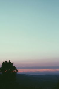 Scenic view of silhouette landscape against sky at sunset