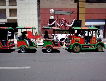 Vehicles on road along buildings