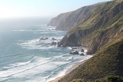 Scenic view of beach against clear sky