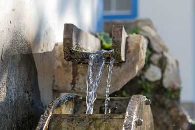 Close-up of water falling on wheel