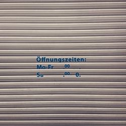 Text on corrugated shutter