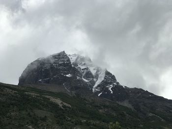 Low angle view of mountain range against sky