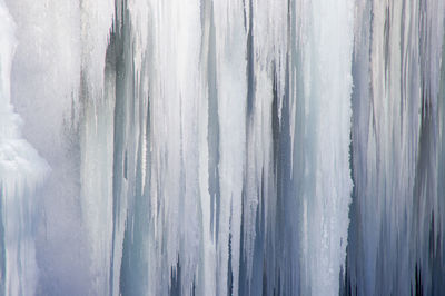 Full frame shot of icicles against sky