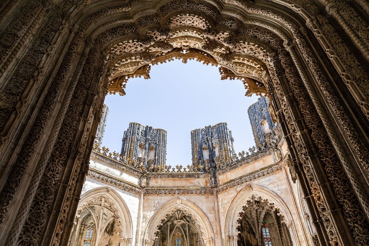 low angle view, architecture, built structure, arch, building exterior, history, travel destinations, the past, no people, day, building, sky, religion, tourism, travel, clear sky, belief, place of worship, outdoors, architecture and art, ceiling, architectural column, ornate