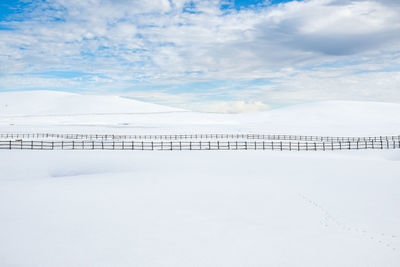 Scenic view of snow covered field against sky in accumoli, lazio italy 