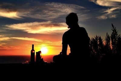 Silhouette of built structure at sunset