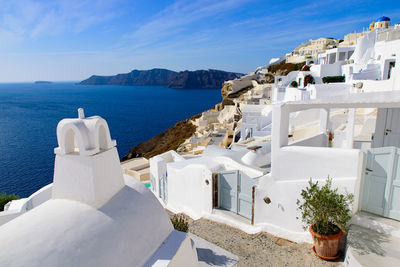 Panoramic view of sea and buildings against sky