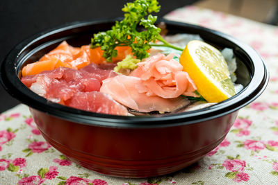 Close-up of chirashi served in bowl on table at home