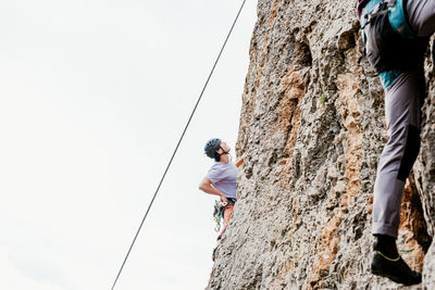 Rear view of man walking on rock