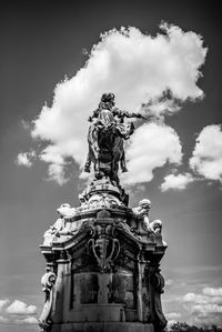 Low angle view of statue against sky