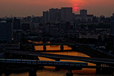 High angle view of buildings against sky during sunset