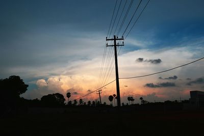 Low angle view of electricity pylon against sky