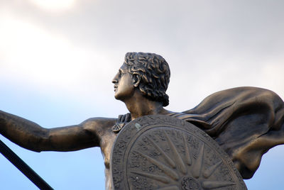 Low angle view of statue against sky