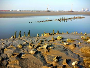 Calm river against clear sky