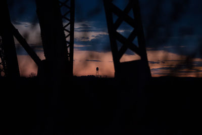 Silhouette of building at sunset