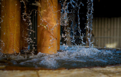 Close-up of water splashing on wall