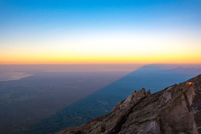 Scenic view of mountains against sky during sunset