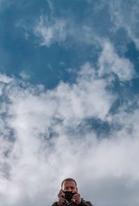 Low angle view of man against sky