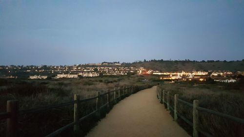 View of illuminated buildings against clear sky