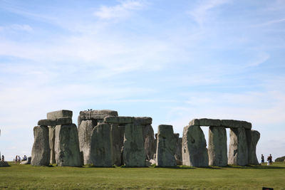 Built structure on field against sky