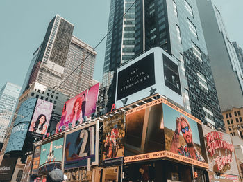 Low angle view of modern buildings against sky in city