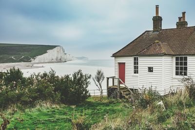 House by sea against sky