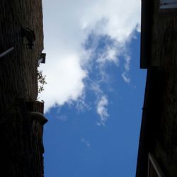 Low angle view of building against blue sky