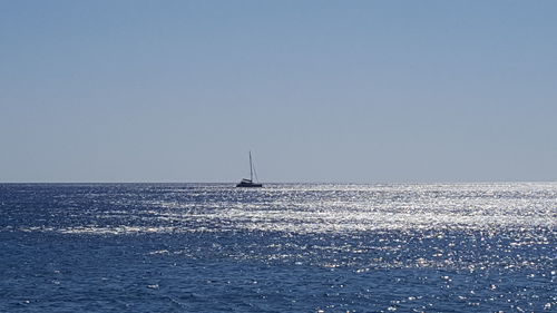 Sailboat sailing in sea