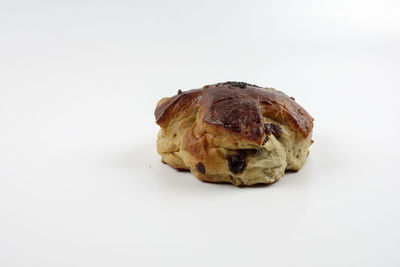 Close-up of bread against white background