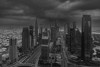 High angle view of cityscape against cloudy sky