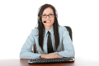 Smiling young woman using smart phone