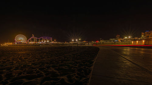 Illuminated ferris wheel at night