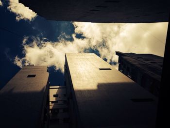 Low angle view of building against cloudy sky