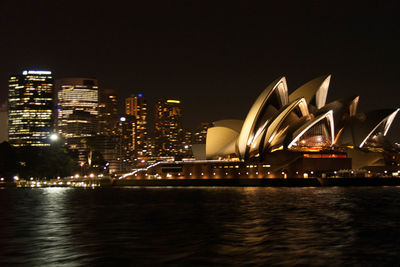 Illuminated buildings in city at night