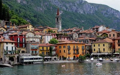 Boats in river with buildings in background